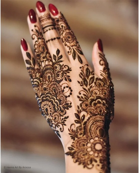 Fine Tulip With Knot Covering Back Hand Mehndi Design Fine Tulip With Knot Covering Back Hand Mehndi Design
